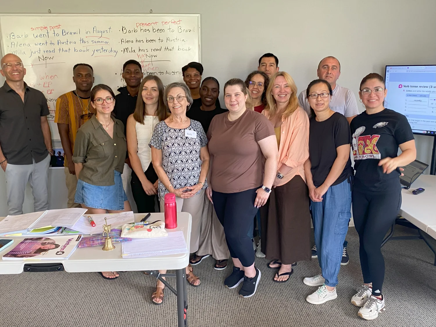 A group photo with teachers and students in a classroom
